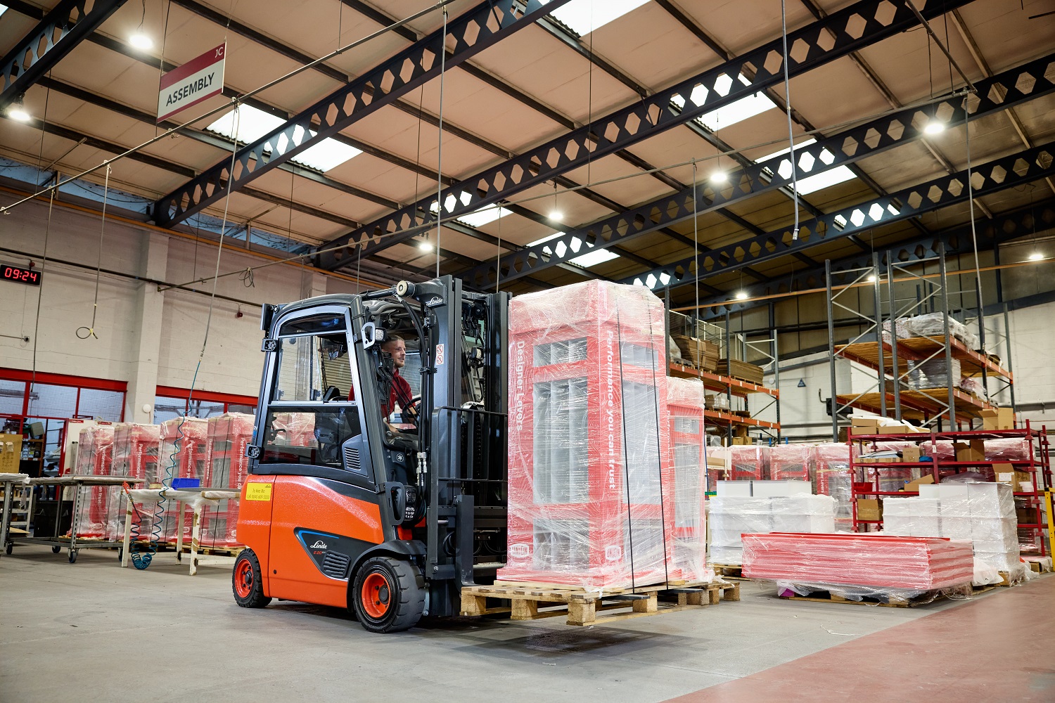 staff on machine at jc metalworks warehouse