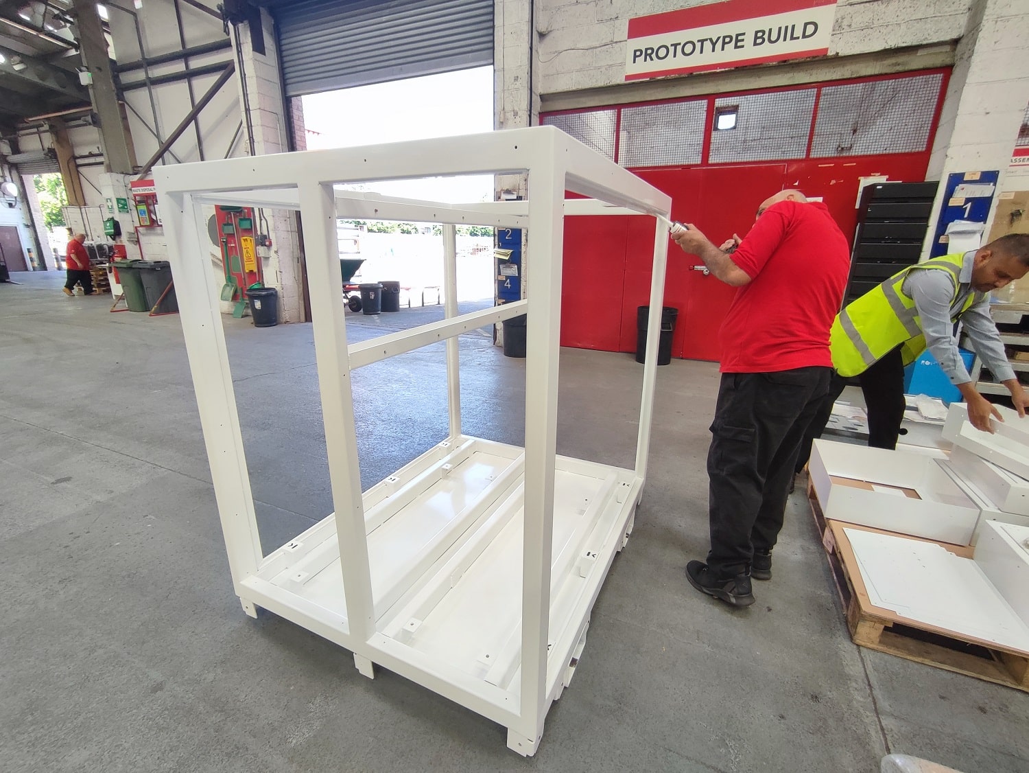 JC metalworks worker assembles enclosure