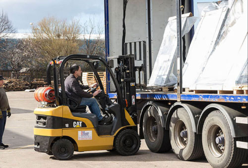 JC Metalworks employee loading a delivery truck.