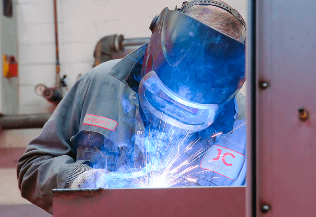 JC Metalworks employee welding